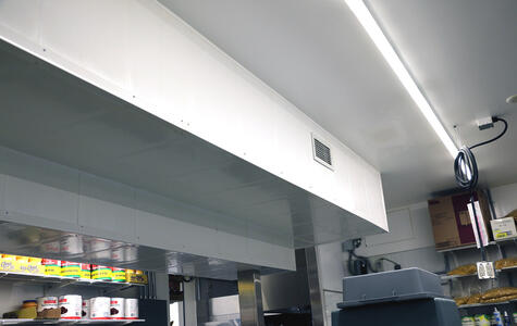 Trusscore white wallandceilingboard installed in a commercial kitchen